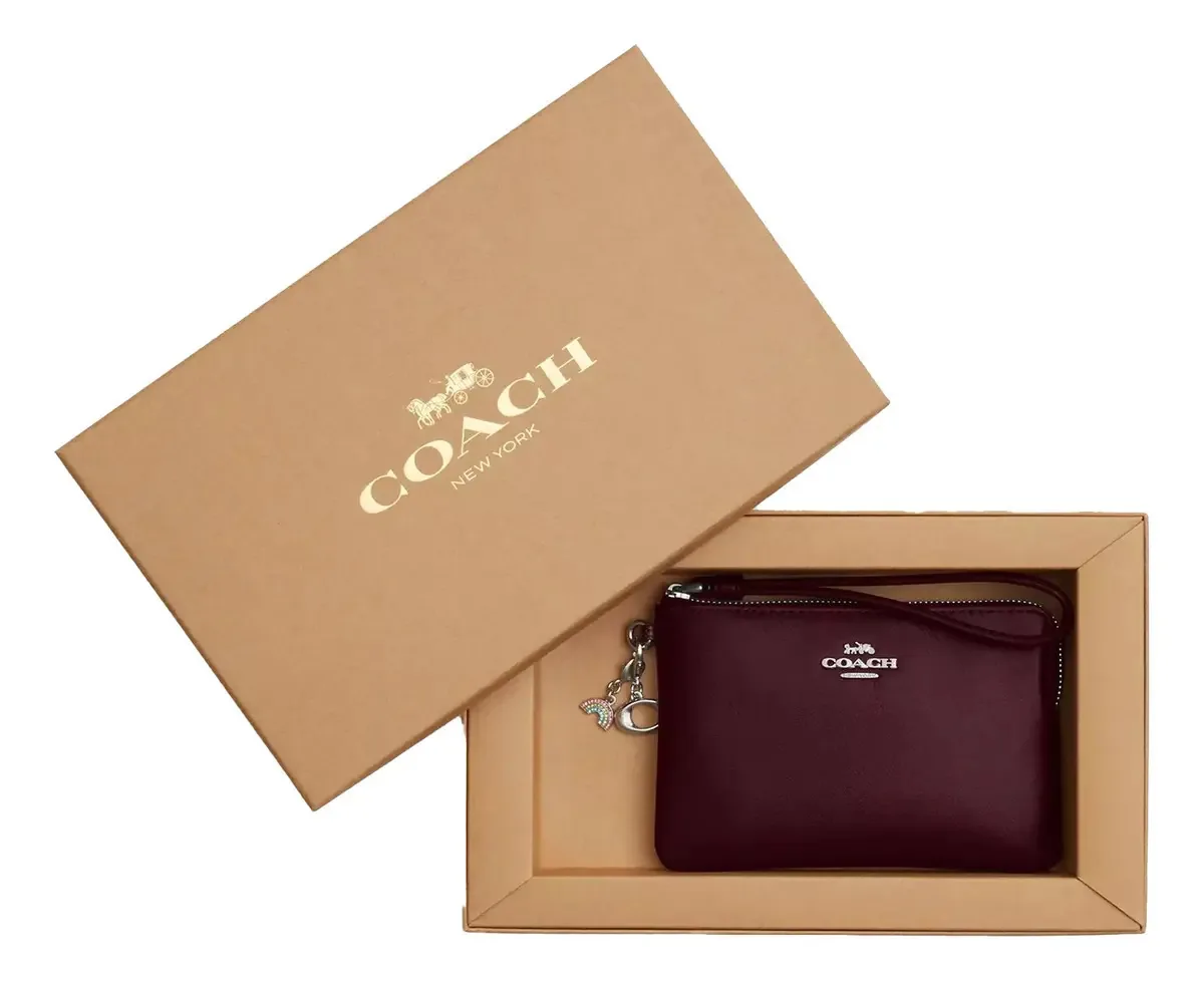 Bolsa de couro Coach com caixa e pingentes - preta, vinho sólido